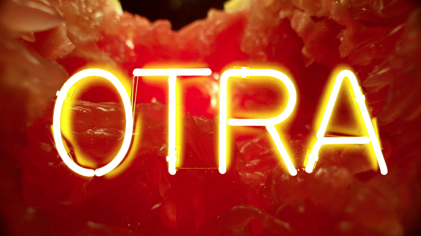 composited grapefruit with neon sign